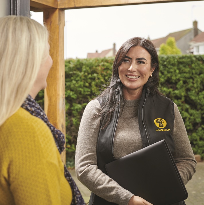 An NFU Mutual agent calls at a customers home with paperwork