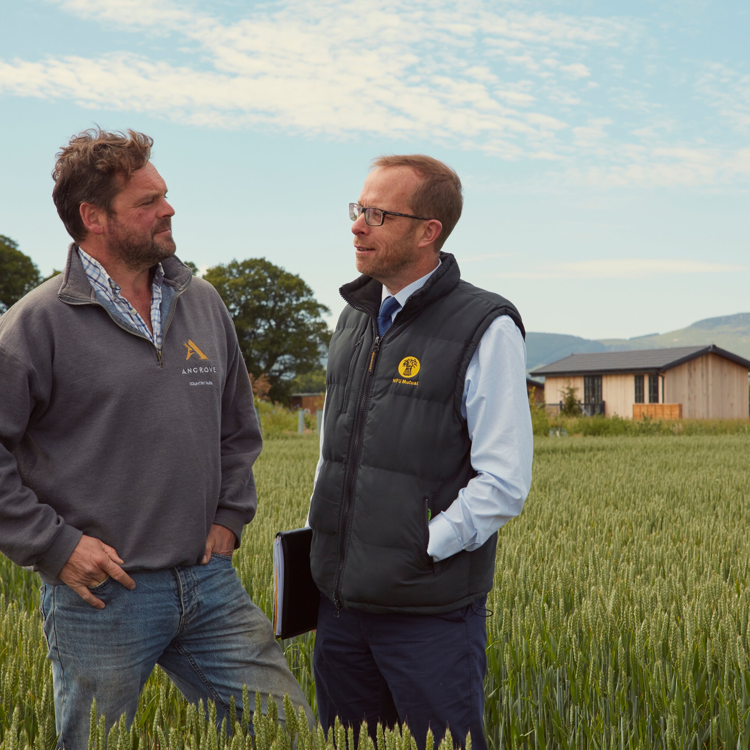 Farmer and NFU Mutual agent in field